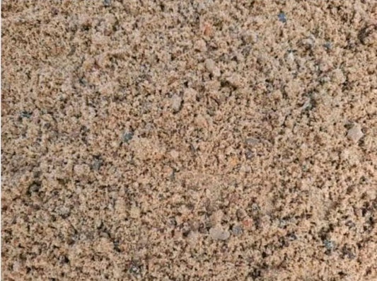 Grau-bräunlicher Estrichkies von nahem betrachtet.