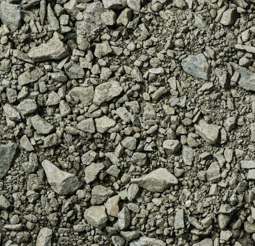 Grün-gräulicher Frostschutz-Schotter von nahem betrachtet.